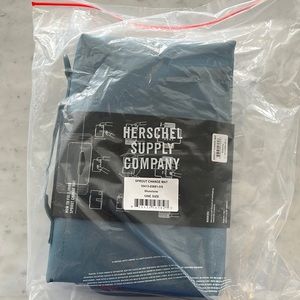 BNIB Herschel Sprout change mat with compartment for wipes. Bluestone colour.